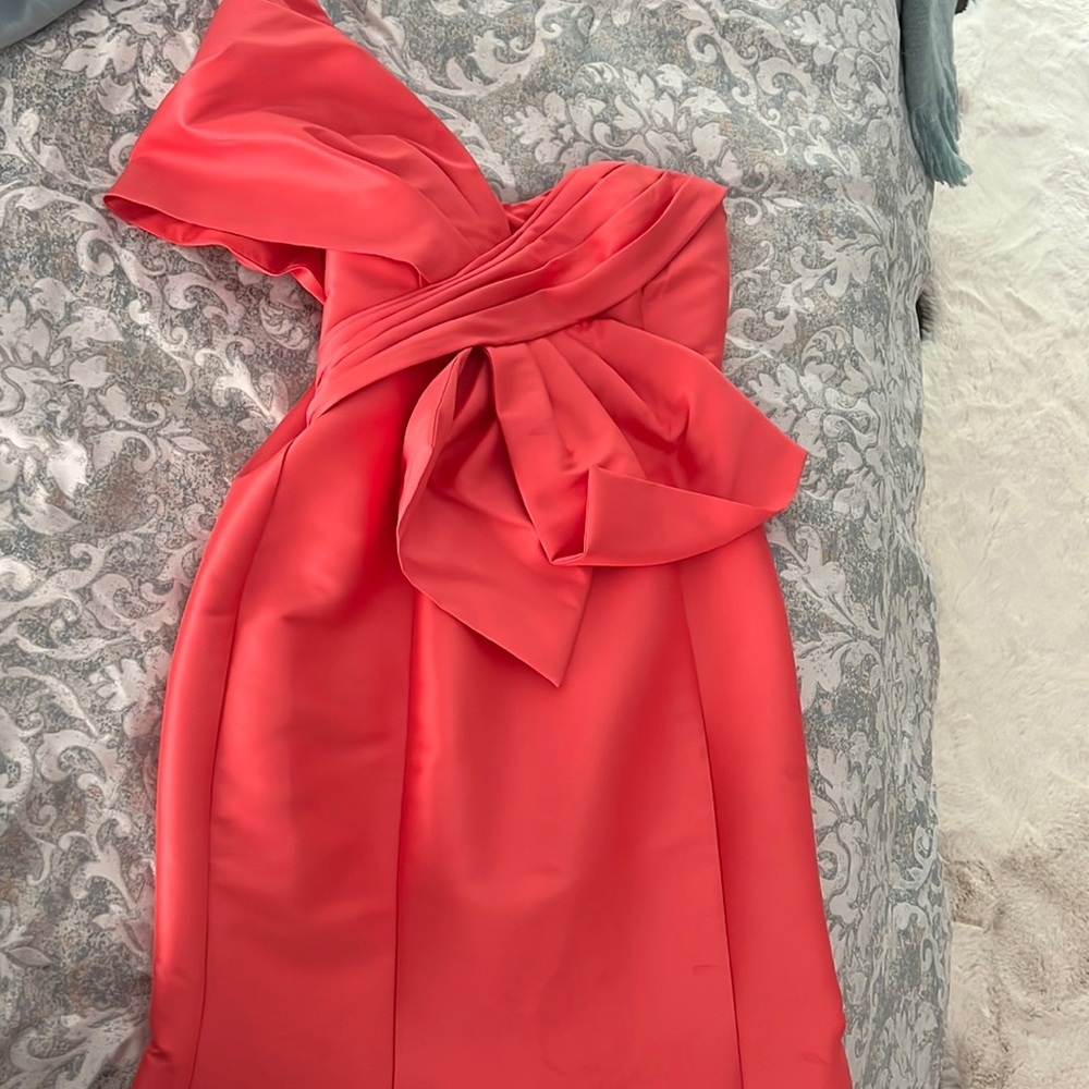 Badgley Mischka's floor-length gown showcases an oversized pinwheel bodice.